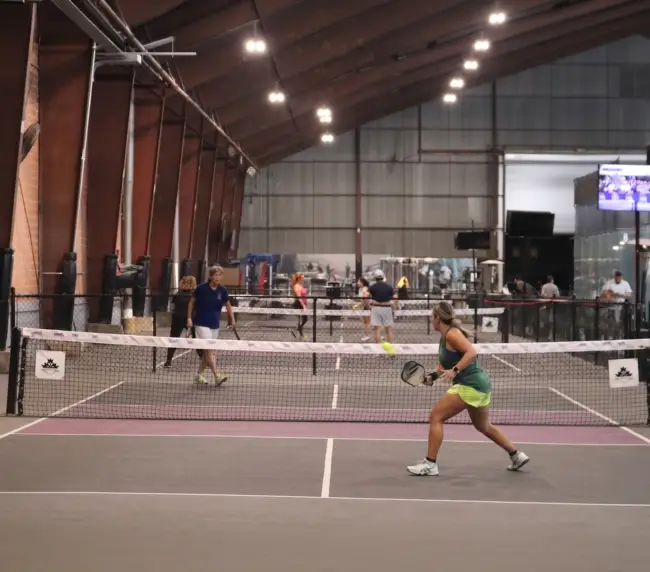 Group of players on court, candid and energetic. Not posed. 